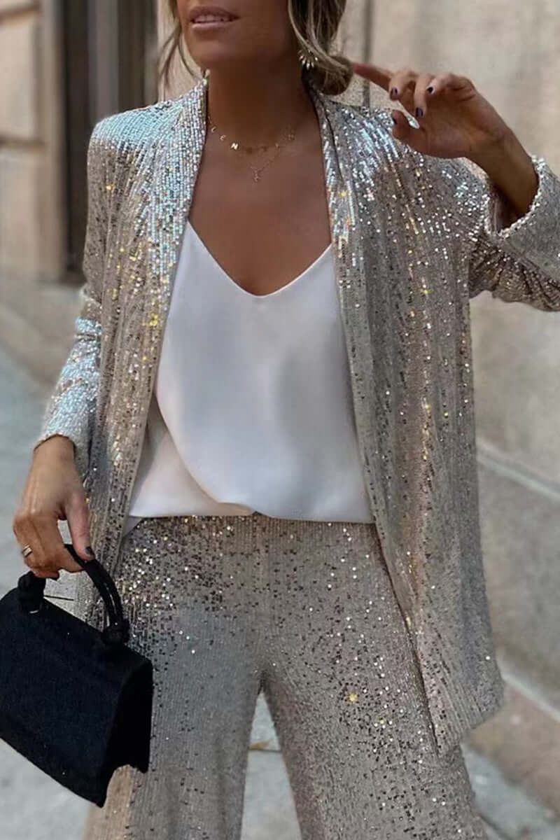 Completo elegante con giacca a maniche lunghe e pantaloni di paillettes
