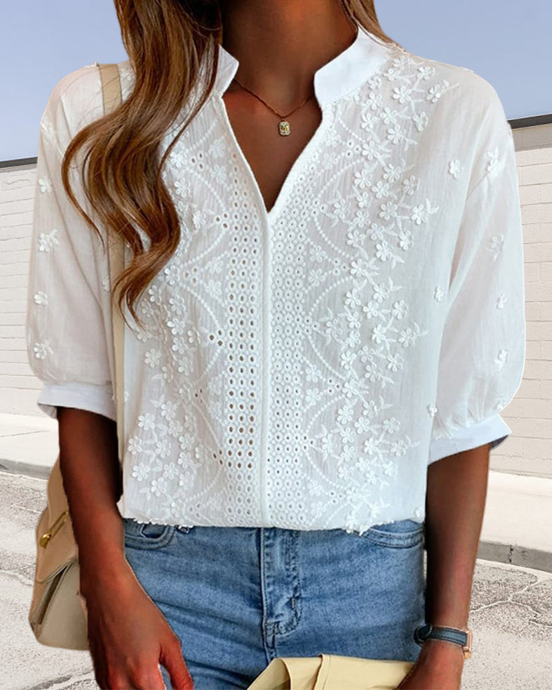 Blusa a tinta unita con maniche corte e scollo a V