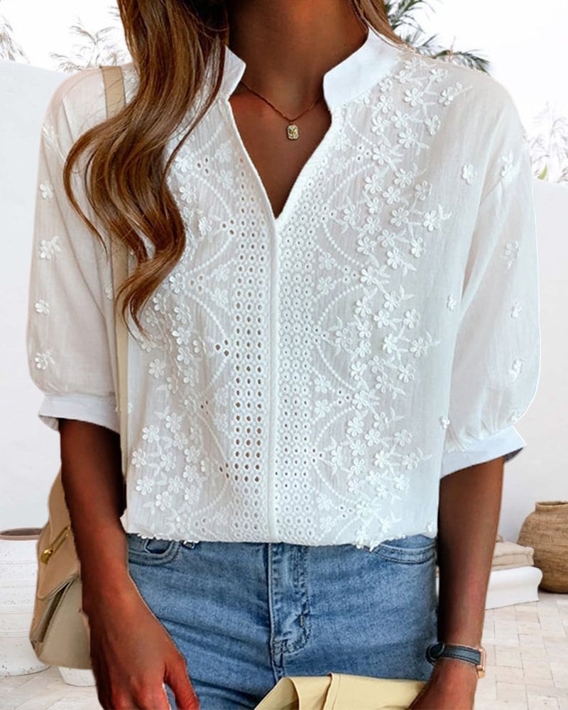 Blusa a tinta unita con maniche corte e scollo a V