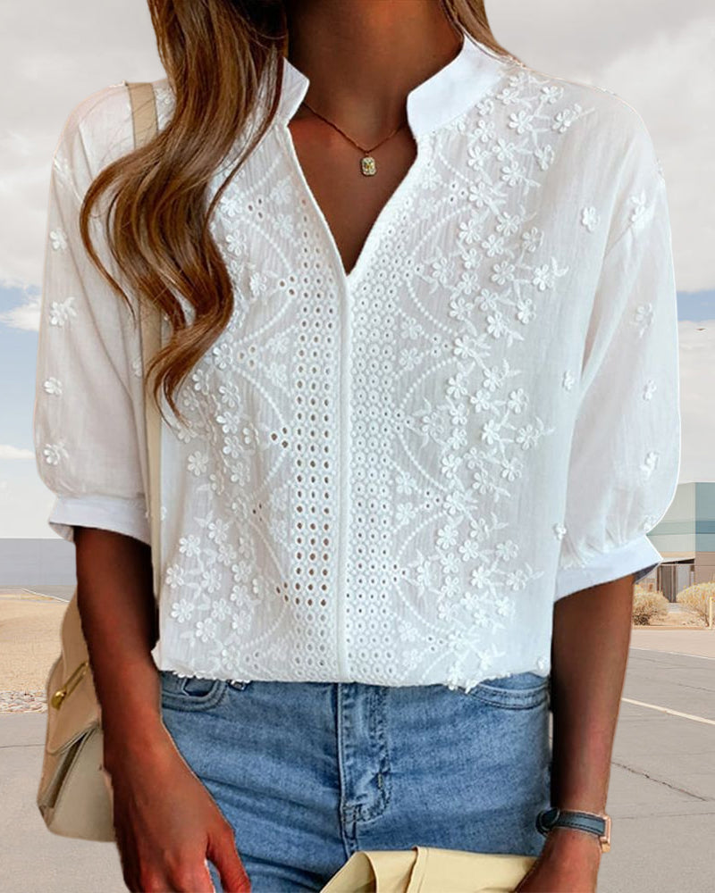 Blusa a tinta unita con maniche corte e scollo a V