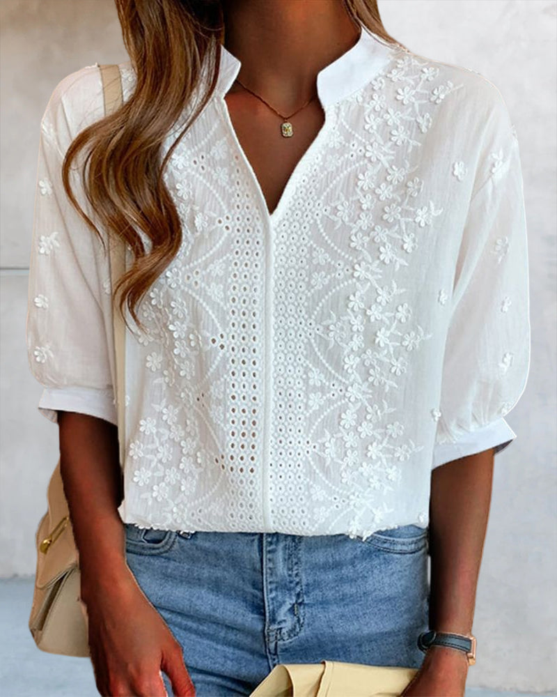 Blusa a tinta unita con maniche corte e scollo a V
