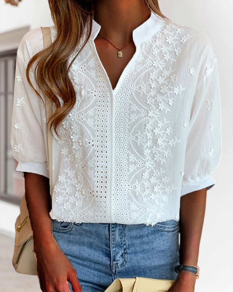 Blusa a tinta unita con maniche corte e scollo a V