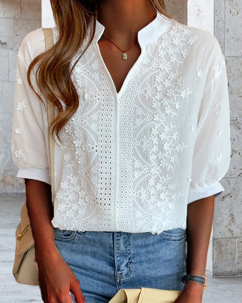 Blusa a tinta unita con maniche corte e scollo a V