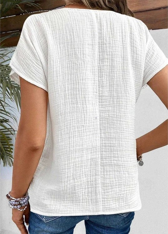 Blusa da donna strutturata con cannoncino dei bottoni