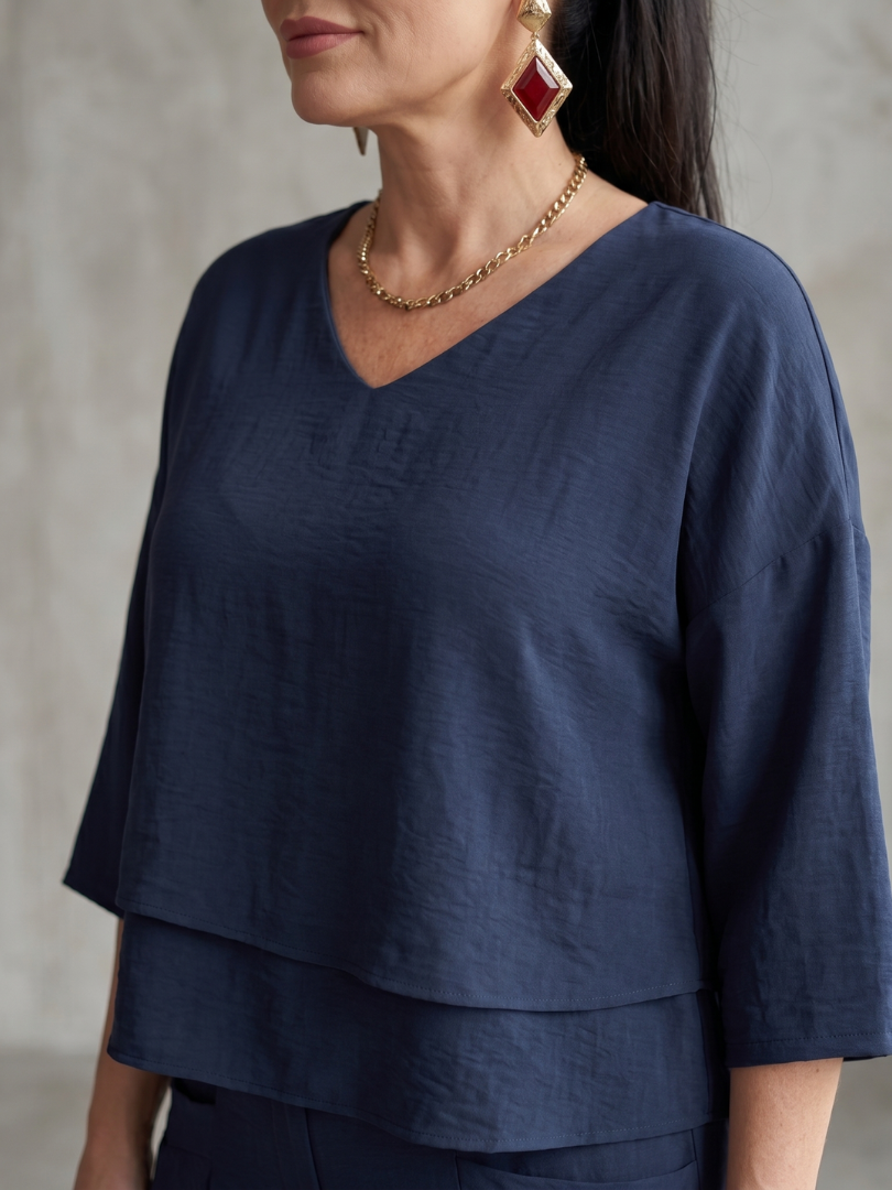 Completo da donna a strati con pantaloni a gamba larga