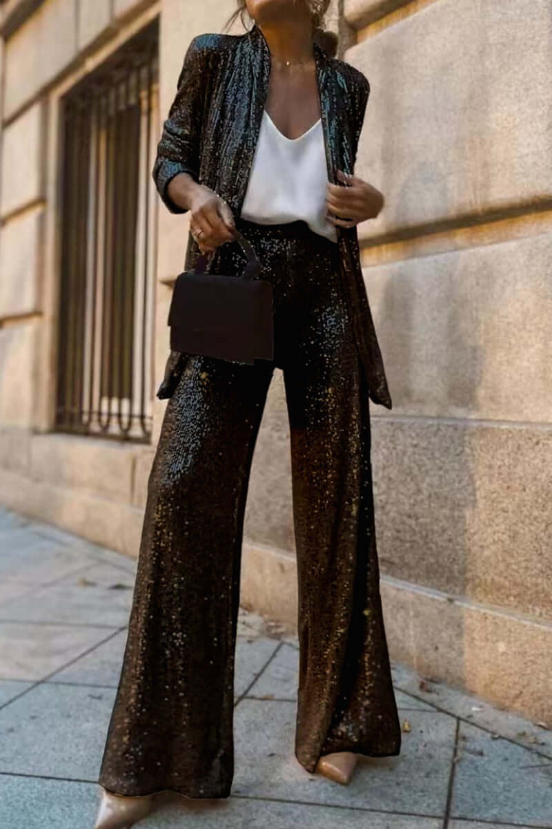 Completo elegante con giacca a maniche lunghe e pantaloni di paillettes