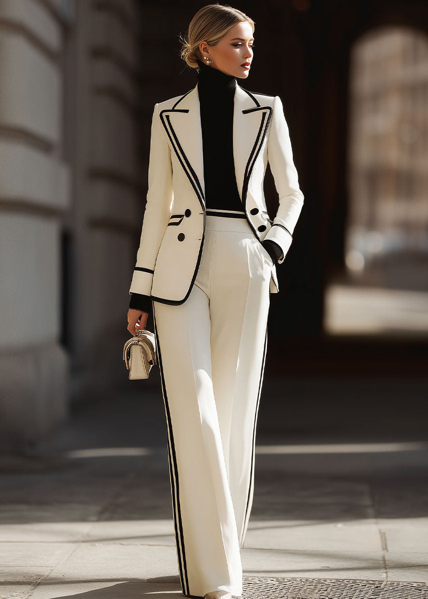 Completo tailleur doppio petto con profili a contrasto
