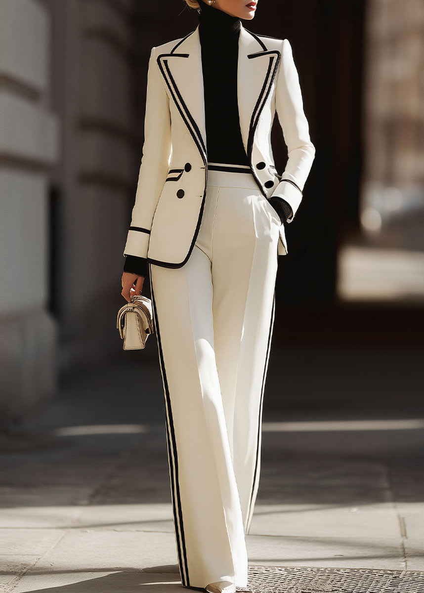 Completo tailleur doppio petto con profili a contrasto