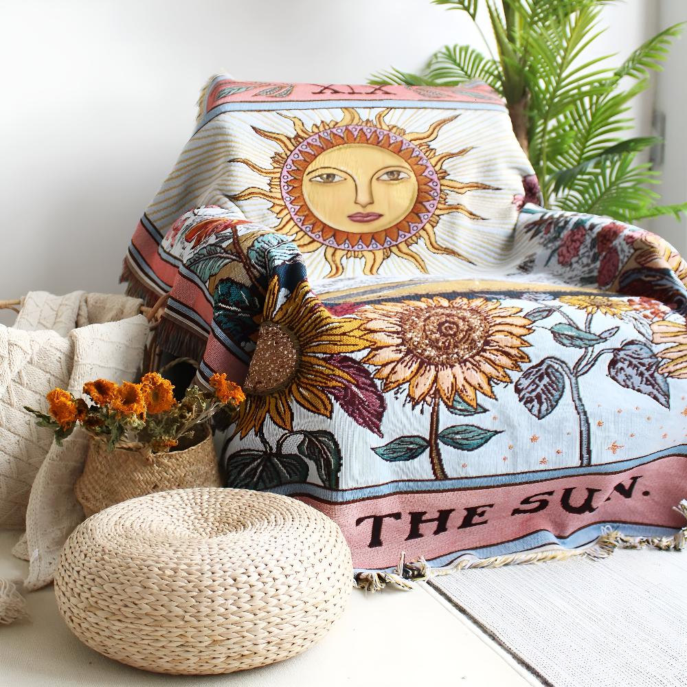 Coperta arazzo in stile boho con motivo a sole