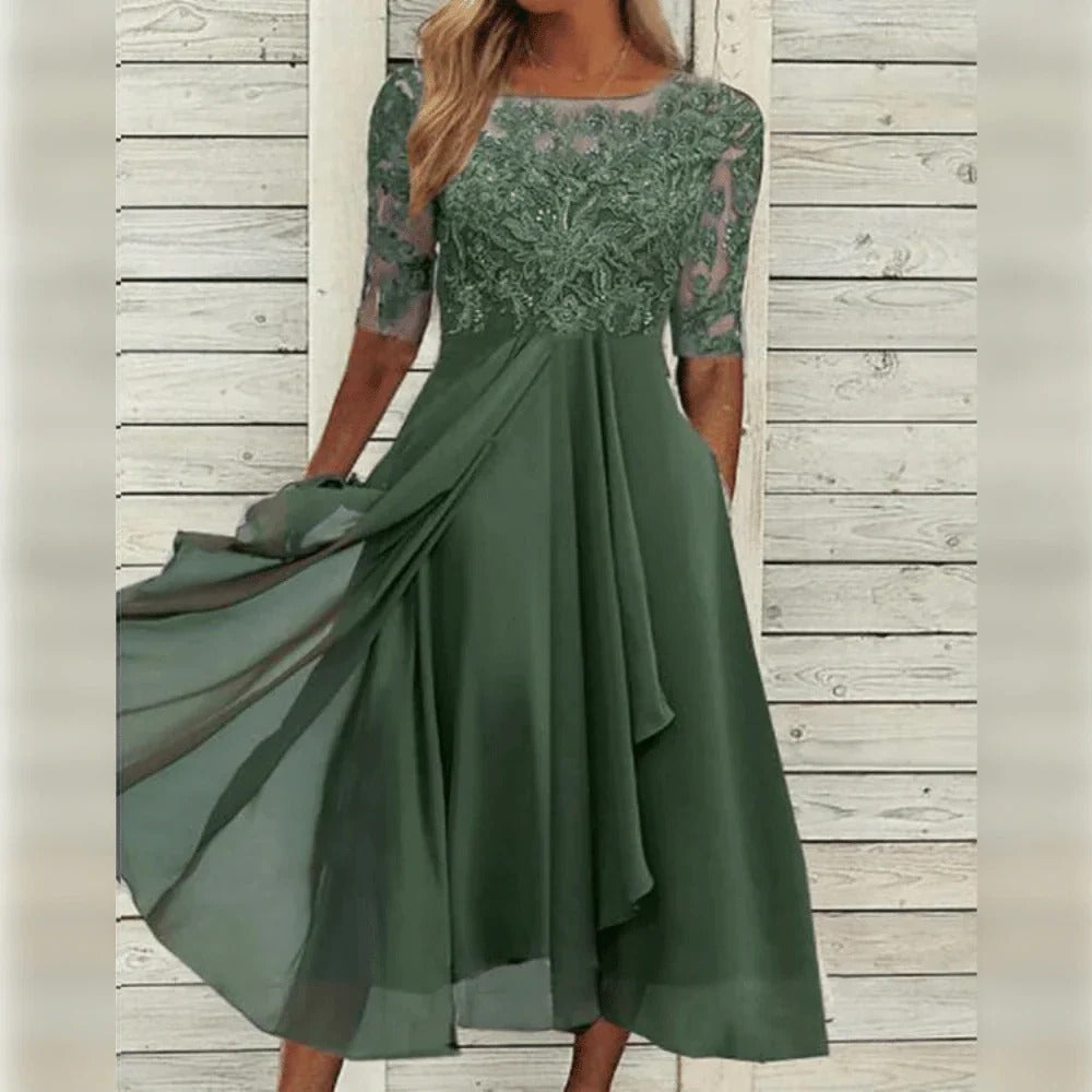 Elegante abito midi da cerimonia con dettagli in pizzo e gonna fluida