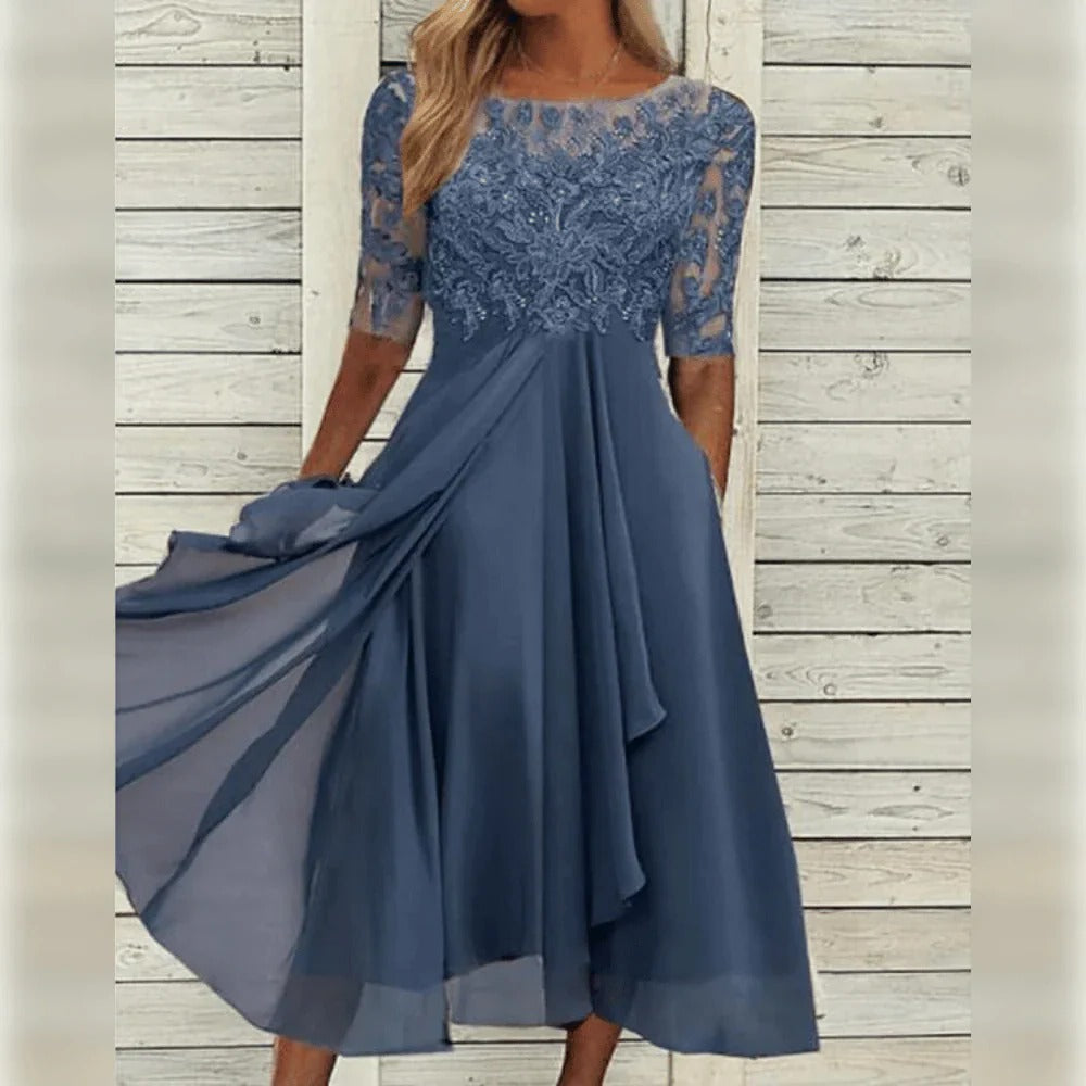 Elegante abito midi da cerimonia con dettagli in pizzo e gonna fluida