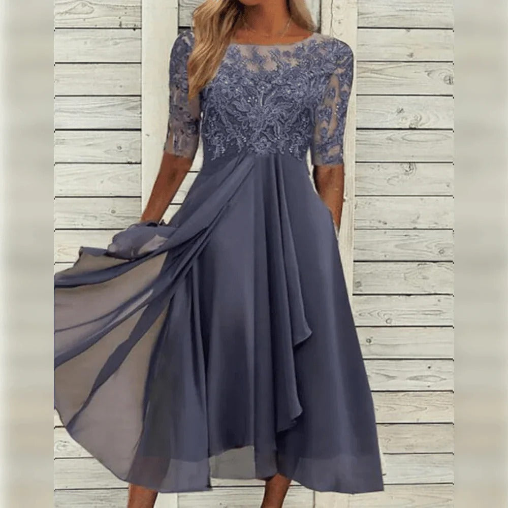 Elegante abito midi da cerimonia con dettagli in pizzo e gonna fluida