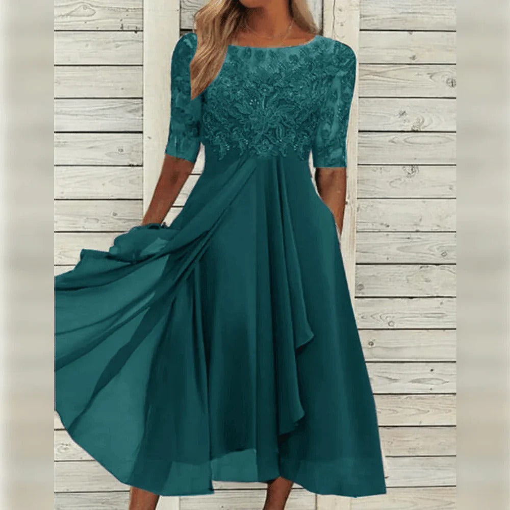 Elegante abito midi da cerimonia con dettagli in pizzo e gonna fluida