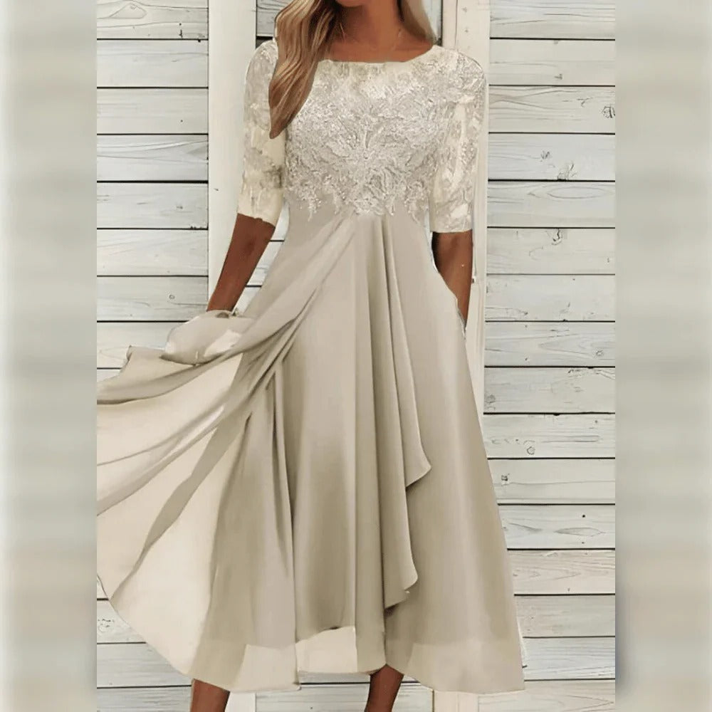 Elegante abito midi da cerimonia con dettagli in pizzo e gonna fluida