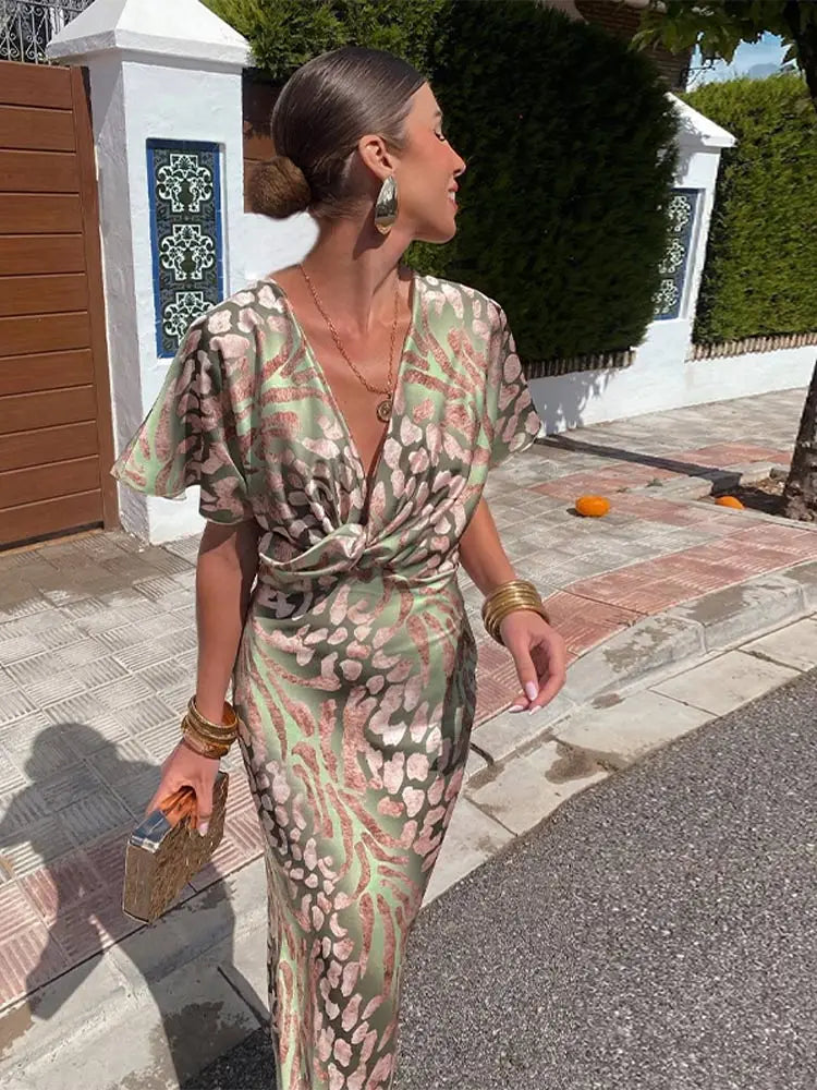 Elegante abito midi da donna con scollo a V e dettaglio nodo
