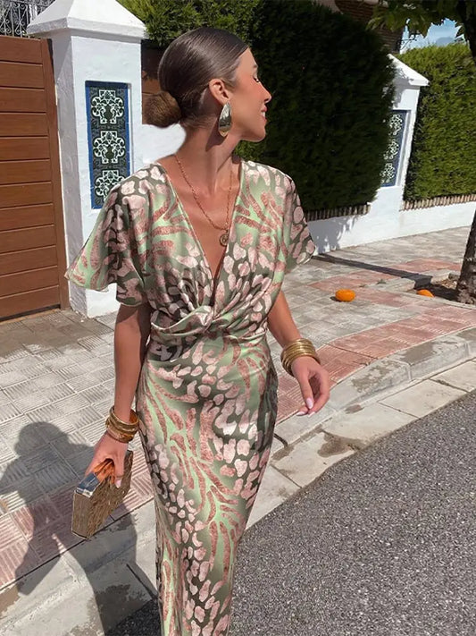 Elegante abito midi da donna con scollo a V e dettaglio nodo
