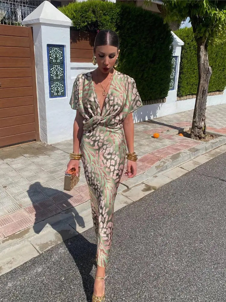 Elegante abito midi da donna con scollo a V e dettaglio nodo
