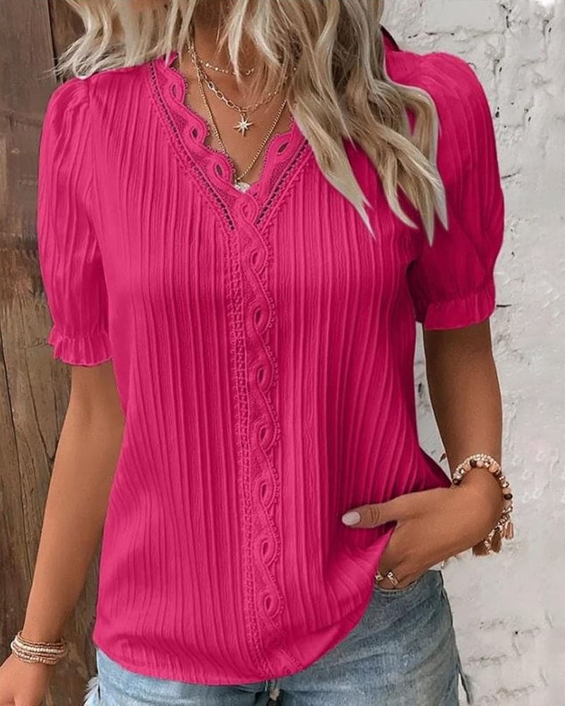 Elegante blusa da donna con pizzo e scollo a V
