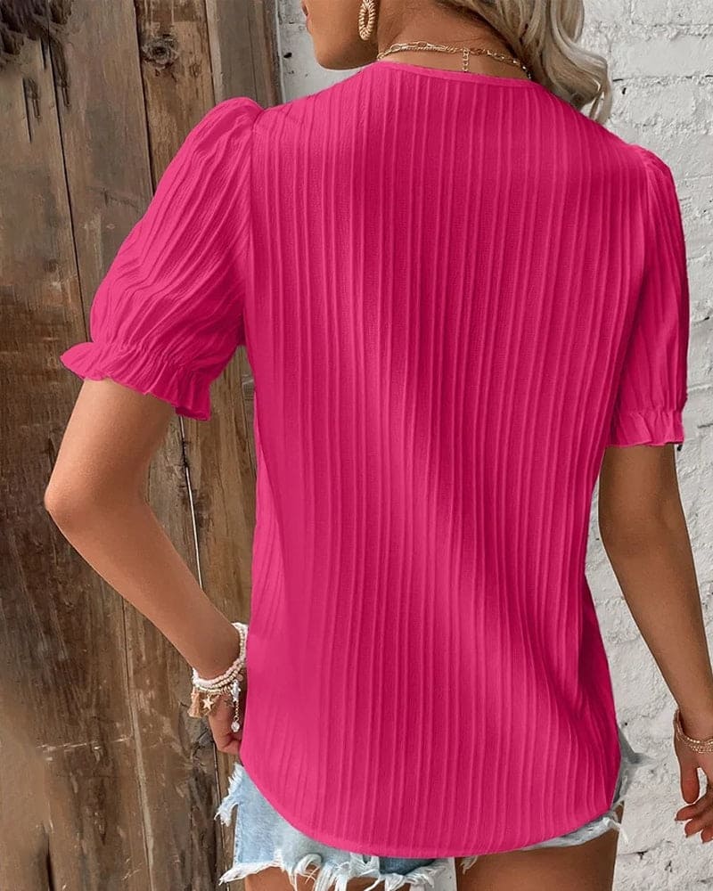 Elegante blusa da donna con pizzo e scollo a V