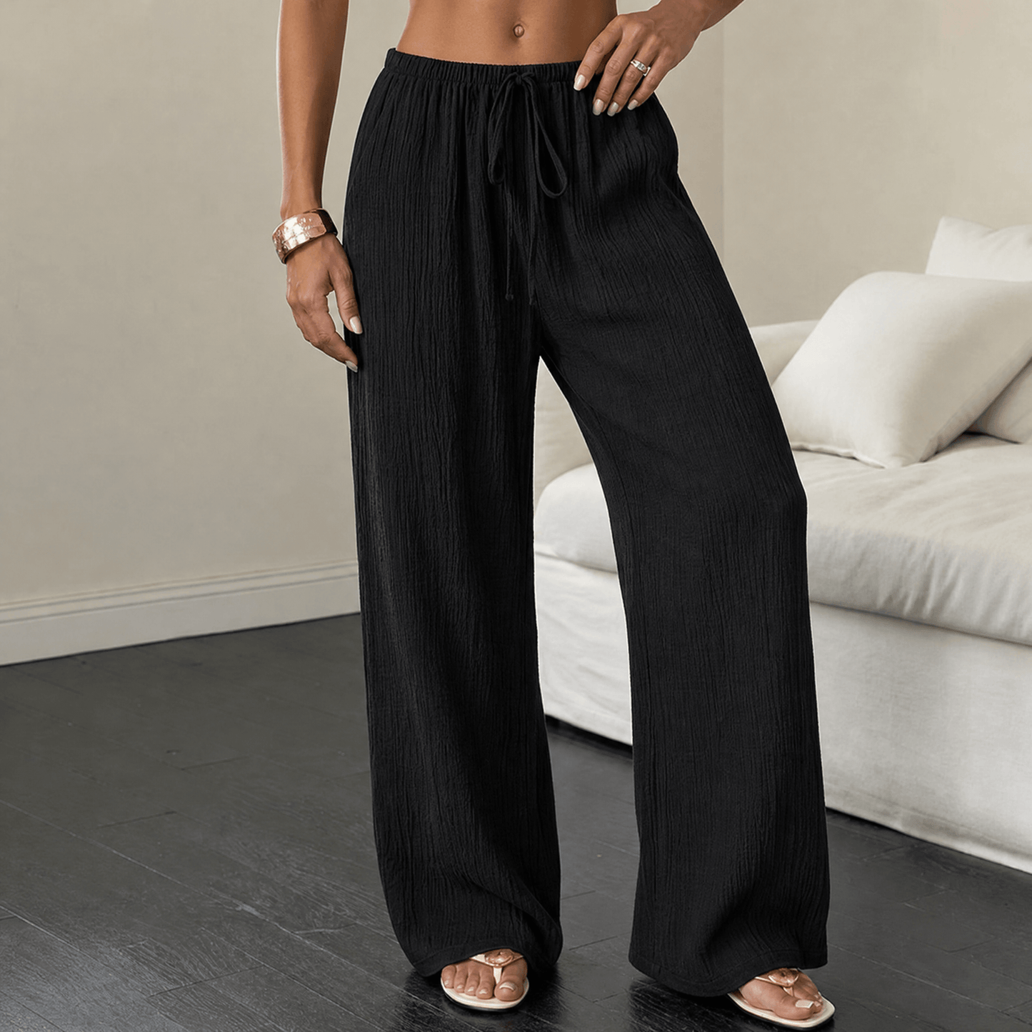 Pantaloni a gamba larga in tessuto goffrato