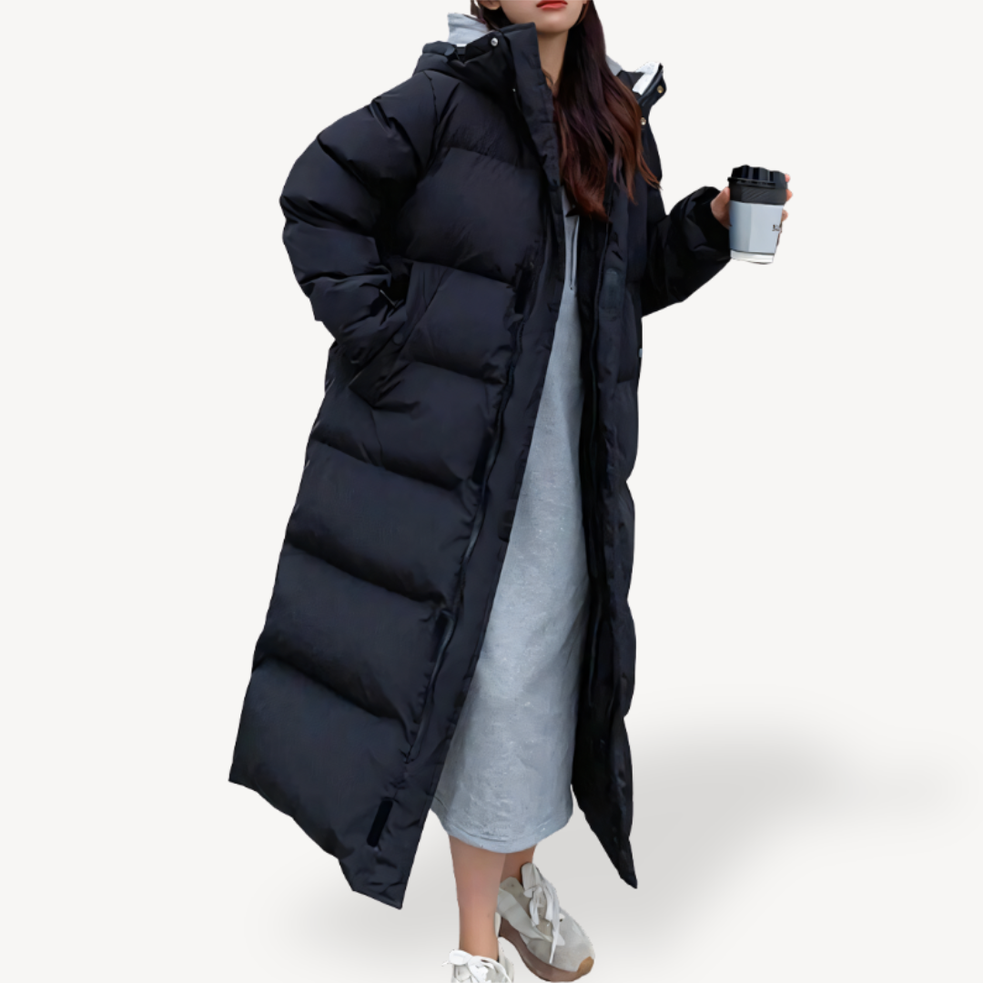 Piumino lungo trapuntato da donna con cappuccio