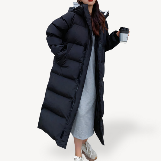 Piumino lungo trapuntato da donna con cappuccio
