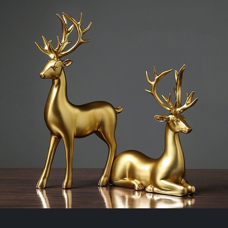 Statuette di coppia di cervi dorate