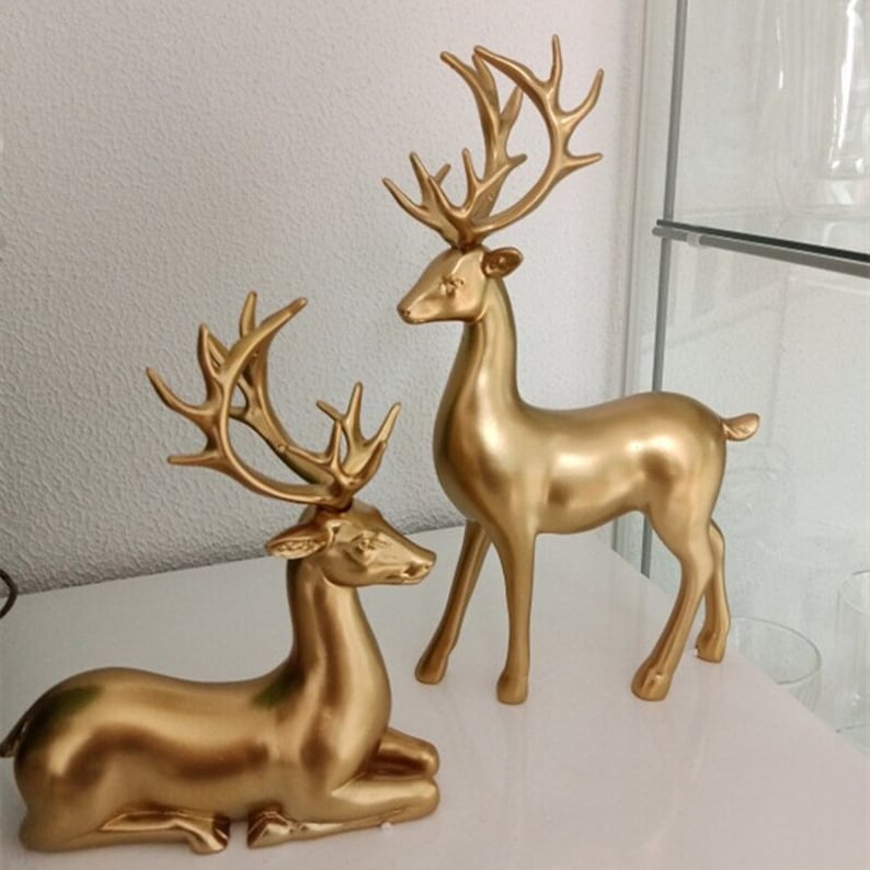 Statuette di coppia di cervi dorate