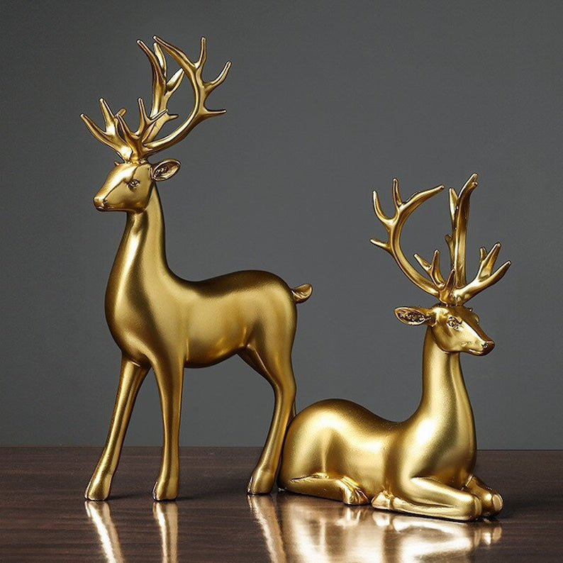 Statuette di coppia di cervi dorate