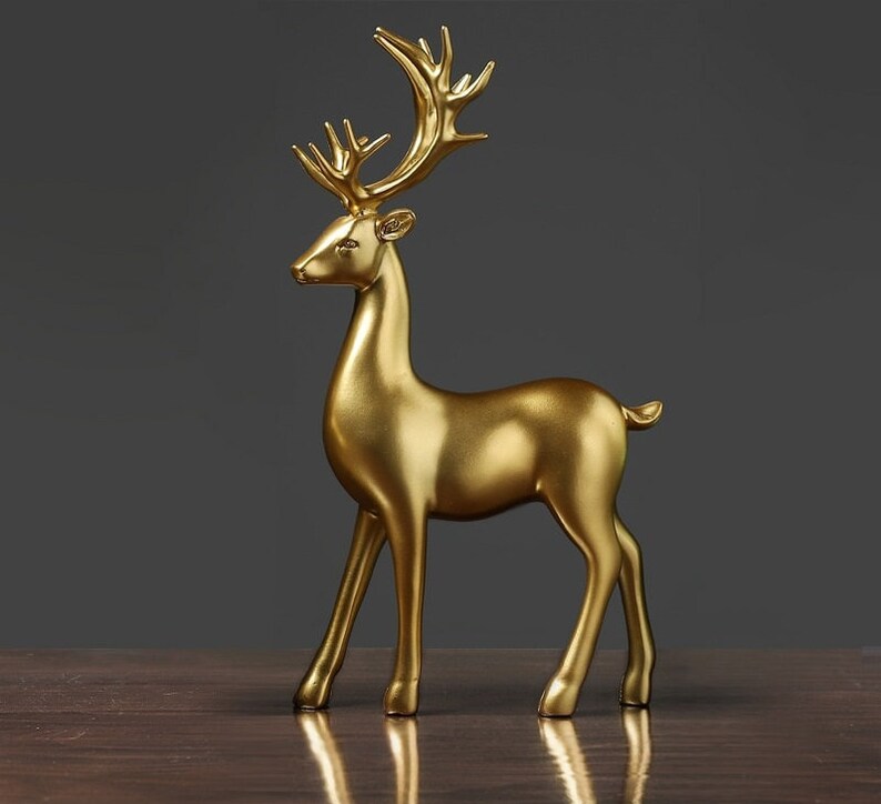 Statuette di coppia di cervi dorate