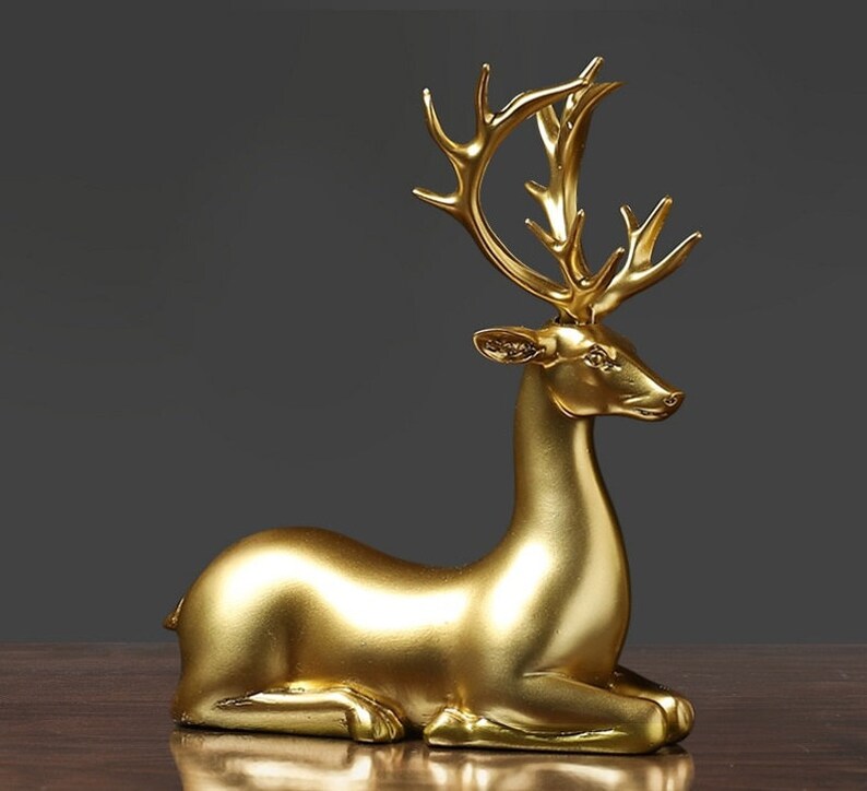Statuette di coppia di cervi dorate