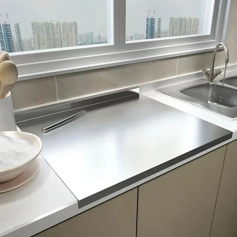 Tagliere in acciaio inox con bordo paragocce