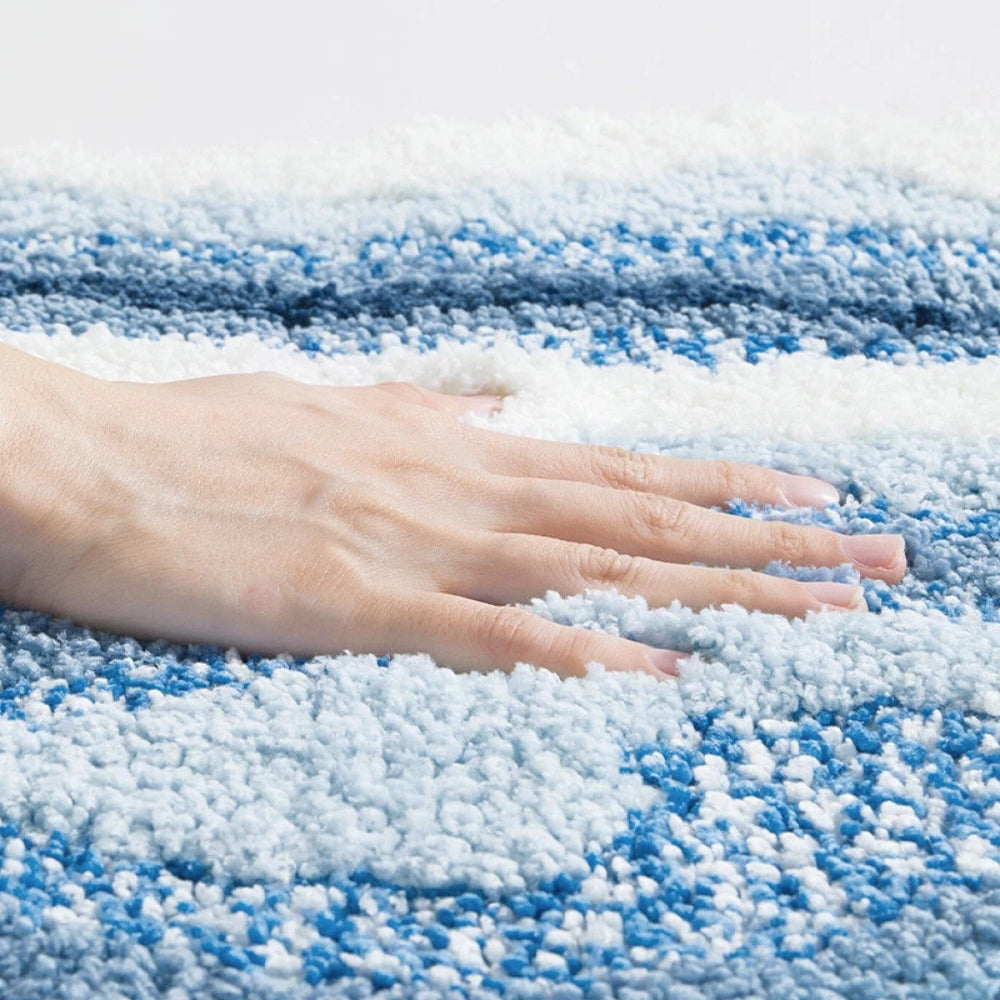Tappetino da bagno con motivo a impronte e tema marino