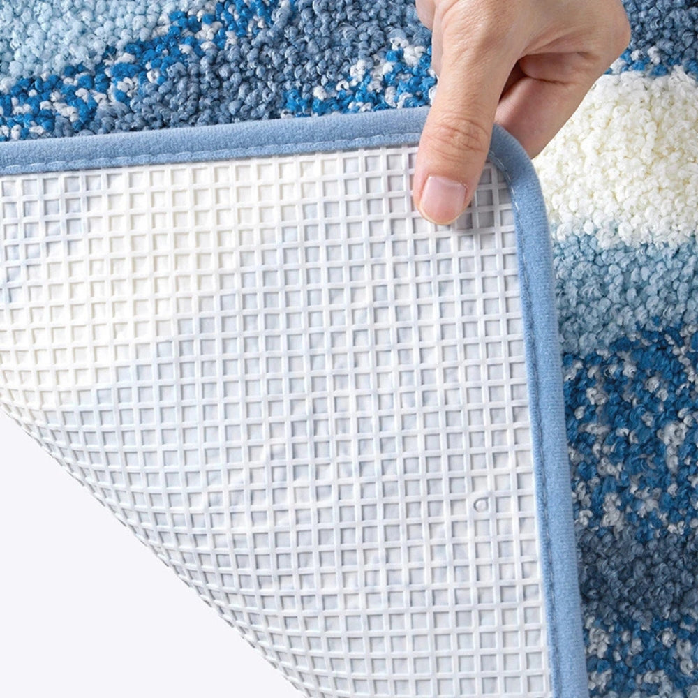 Tappetino da bagno con motivo a impronte e tema marino