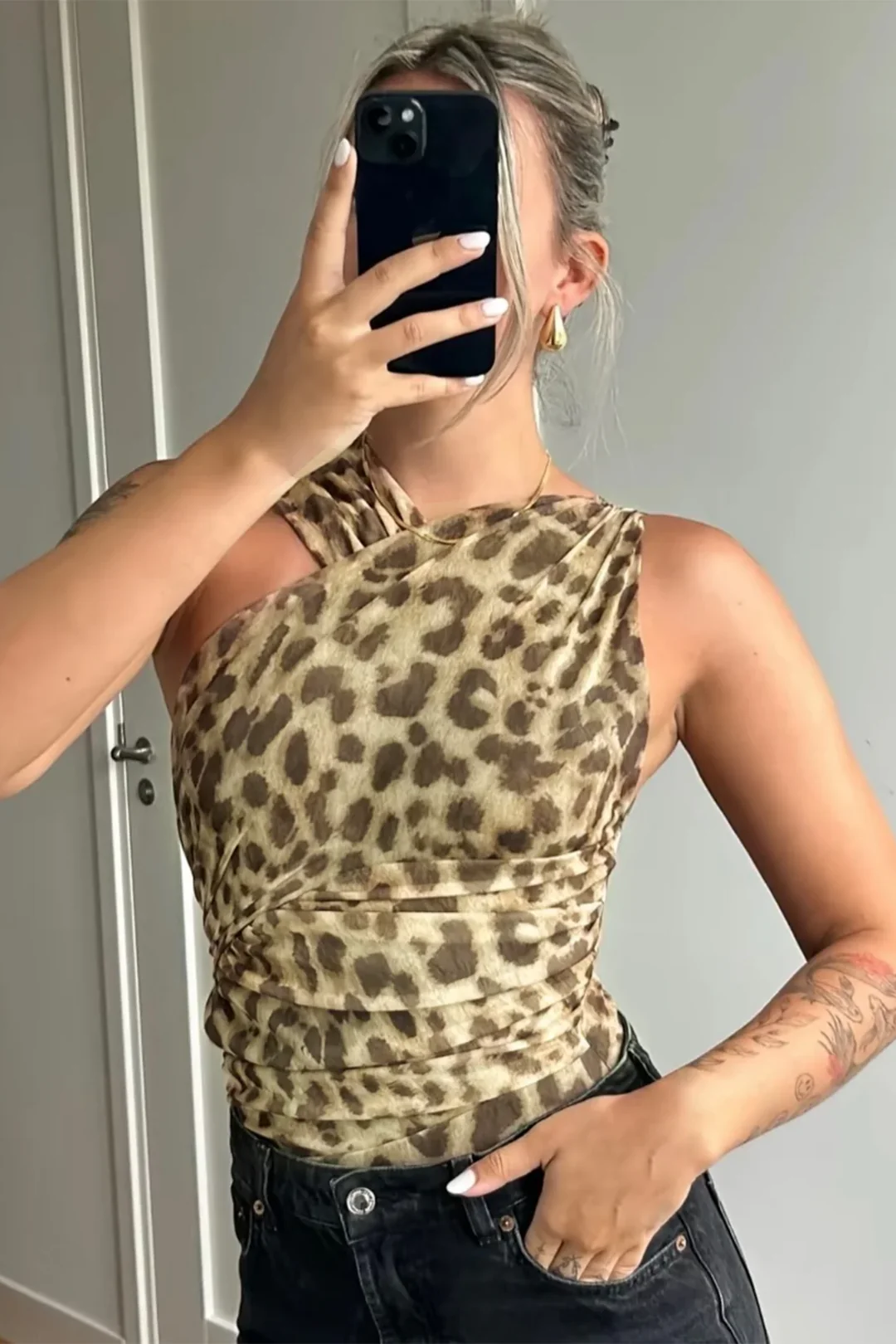 Top asimmetrico con motivo animalier